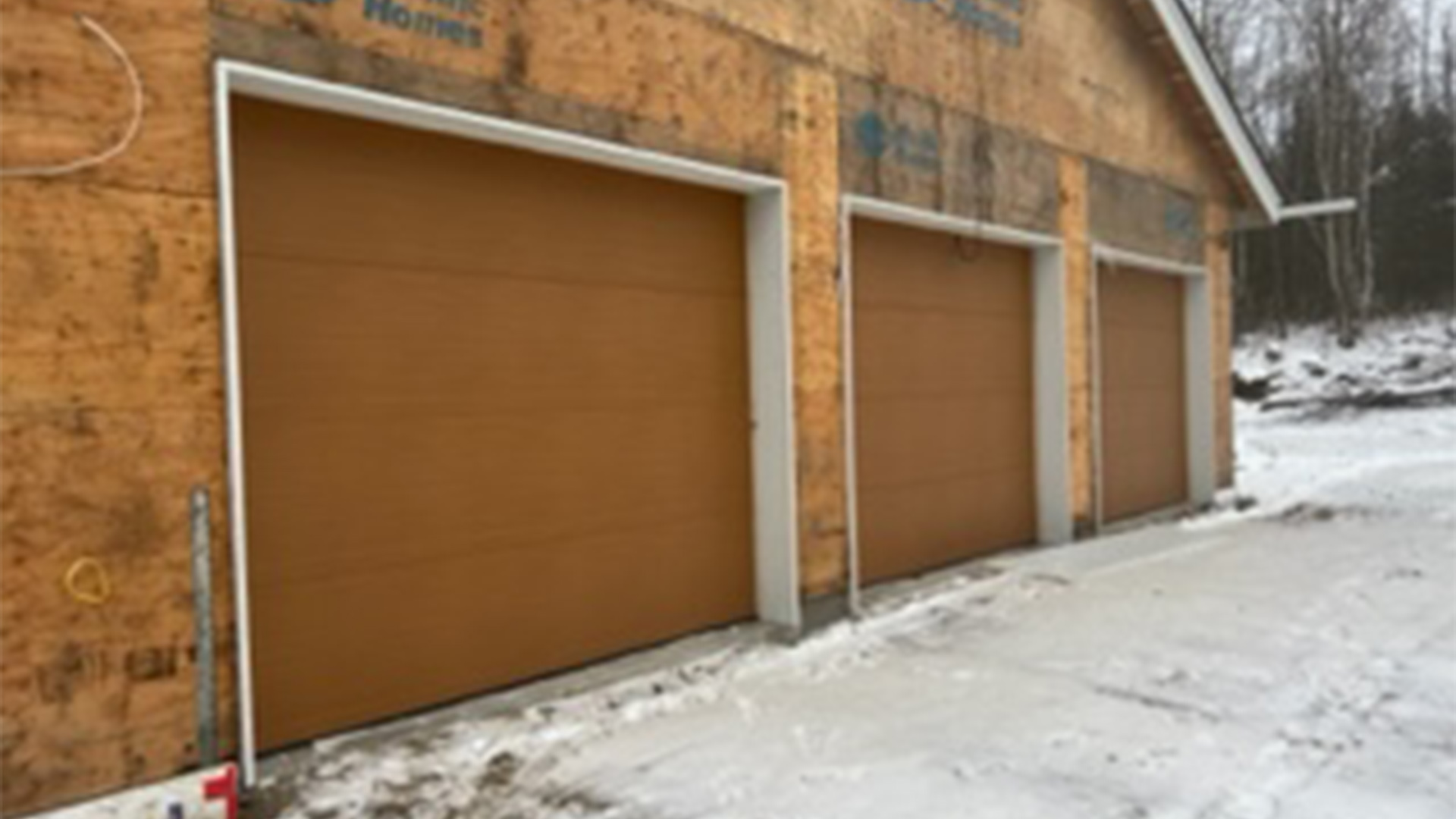 commercial building exteriors with triple garage doors wasilla ak