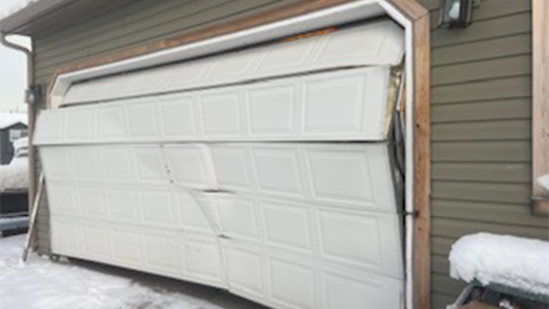 damage garage door at residential property wasilla ak